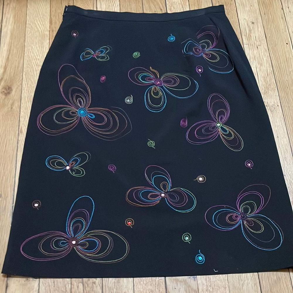 New worn Black skirt fully lined Multi color flowers front/back.